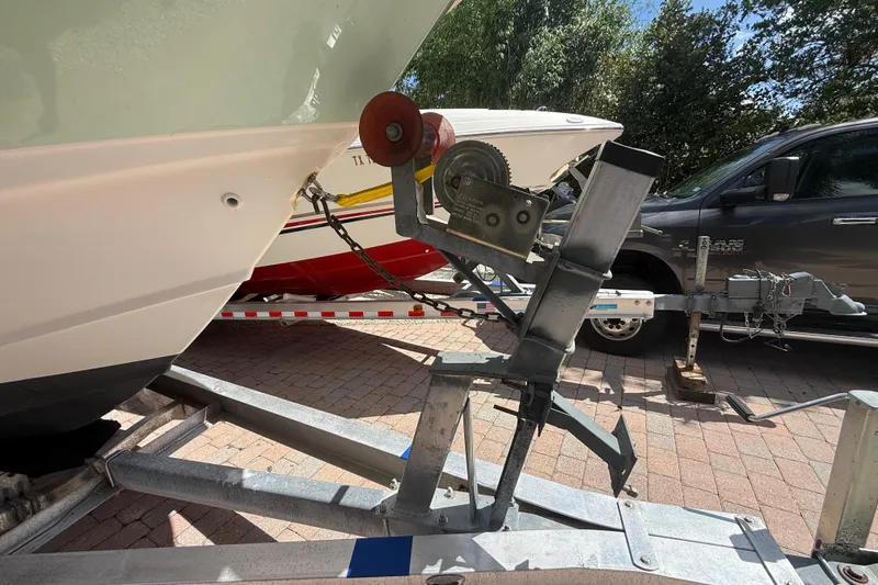 Slide: The Image of Boston Whaler 270 Outrage 2007 boat on trailer, parked on brick driveway. - 34