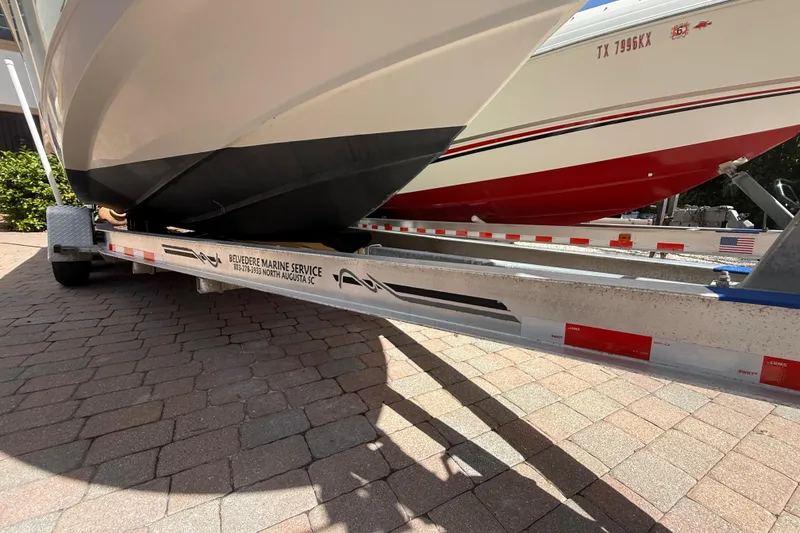 Slide: The Image of 2007 Boston Whaler 270 Outrage on trailer, parked on brick pavement. - 35