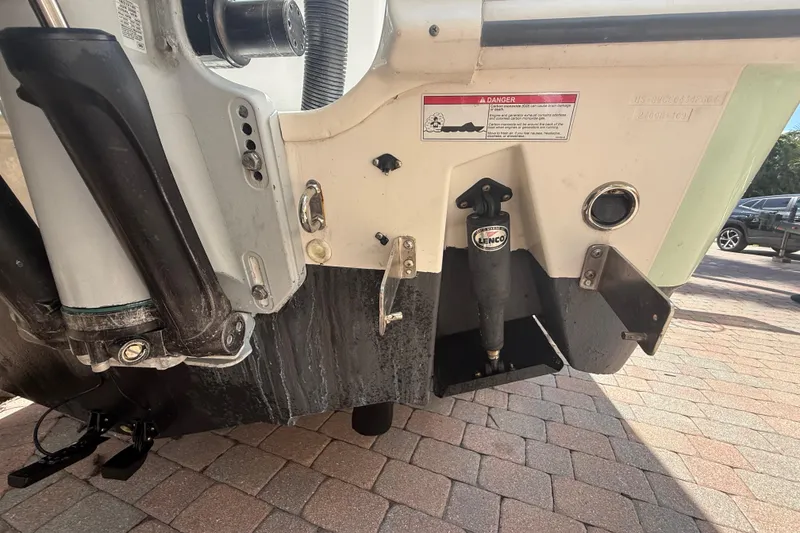 Slide: The Image of Rear view of a 2007 Boston Whaler 270 Outrage boat on a paved surface. - 37