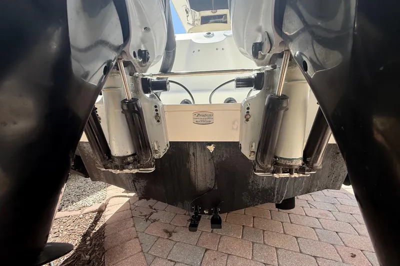 Slide: The Image of Rear view of a 2007 Boston Whaler 270 Outrage boat's dual outboard motors. - 38