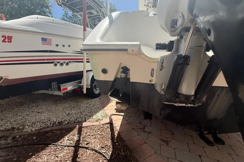 Slide: The Image of 2007 Boston Whaler 270 Outrage boat on trailer, showing engine and hull details. - 39