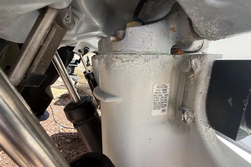 Slide: The Image of Close-up of a 2007 Boston Whaler 270 Outrage engine component with visible wear and label. - 40
