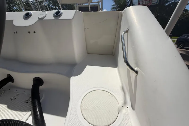 Slide: The Image of Interior view of a 2007 Boston Whaler 270 Outrage boat, featuring seating and controls. - 42