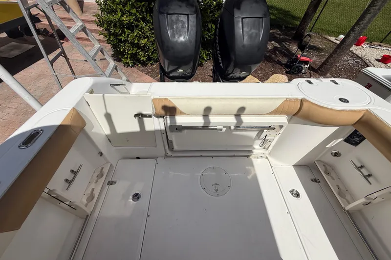 Slide: The Image of 2007 Boston Whaler 270 Outrage boat interior with seating and storage compartments. - 49