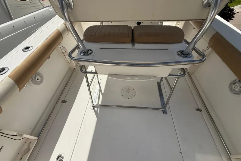 Slide: The Image of 2007 Boston Whaler 270 Outrage interior with cushioned seating and stainless steel railings. - 50