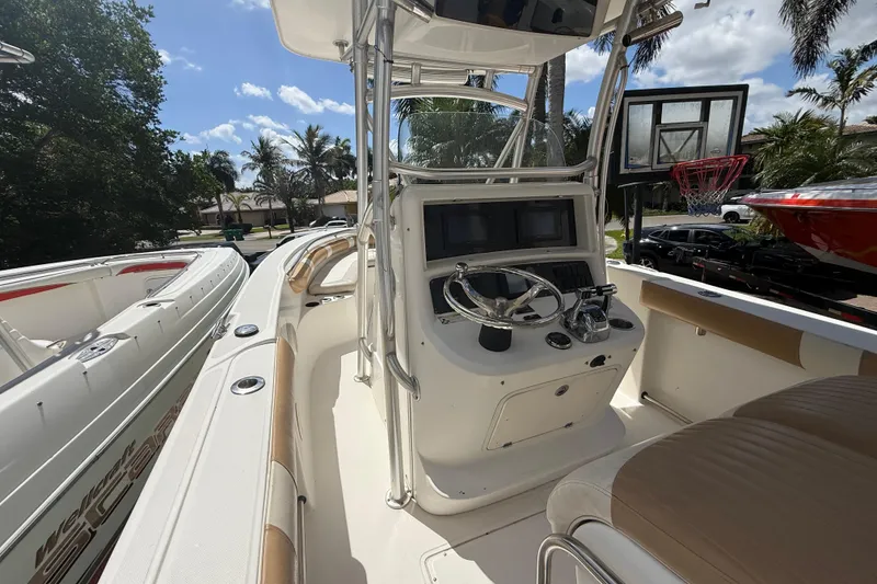 Slide: The Image of 2007 Boston Whaler 270 Outrage boat interior with steering console and seating. - 56