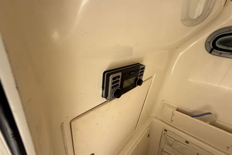 Slide: The Image of 2007 Boston Whaler 270 Outrage cabin interior with mounted control panel. - 70
