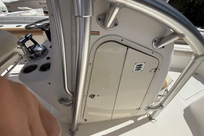 Slide: The Image of 2007 Boston Whaler 270 Outrage console with stainless steel railings and control panel. - 72