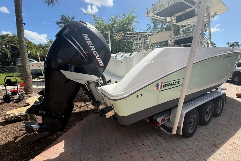 Slide: The Image of 2007 Boston Whaler 270 Outrage boat with Mercury engine on a trailer. - 8