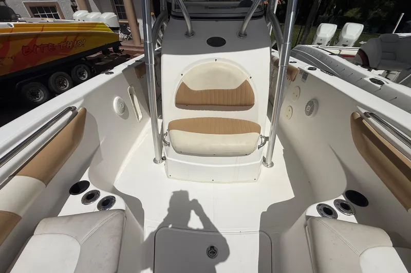 Slide: The Image of 2007 Boston Whaler 270 Outrage boat interior with seating and cup holders. - 82