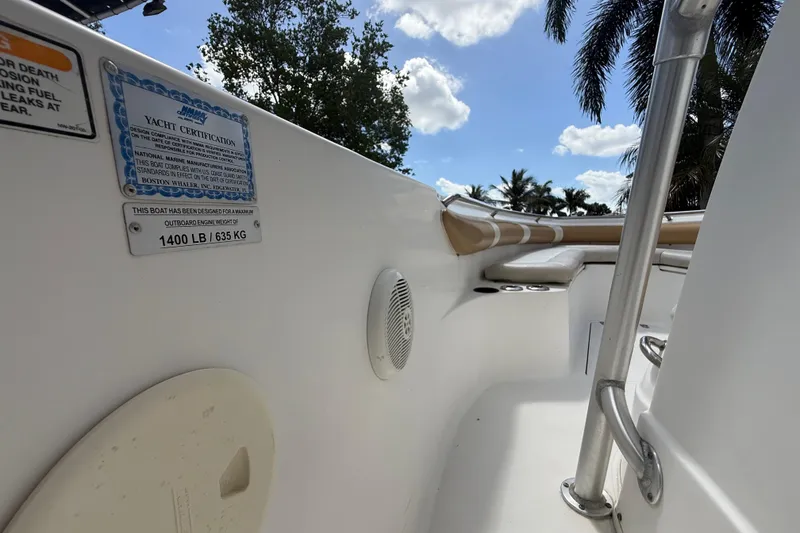 Slide: The Image of 2007 Boston Whaler 270 Outrage interior with yacht certification and weight capacity label. - 91