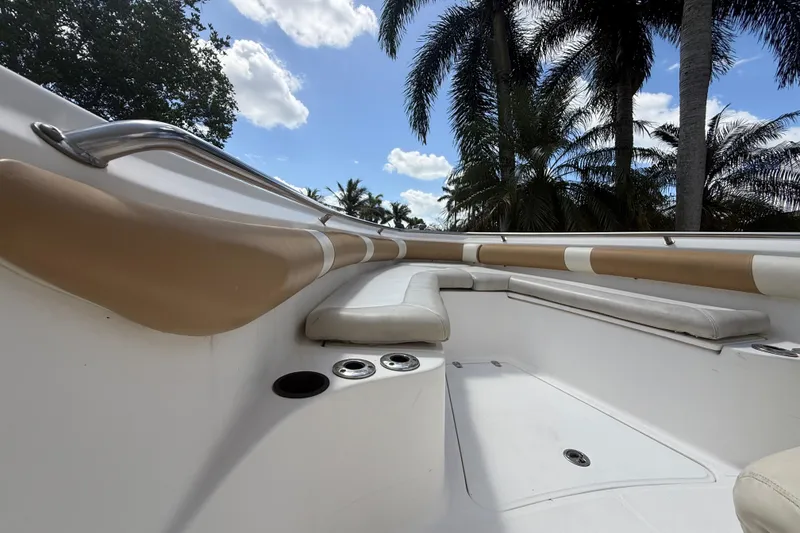 Slide: The Image of Interior view of a 2007 Boston Whaler 270 Outrage boat with cushioned seating. - 92