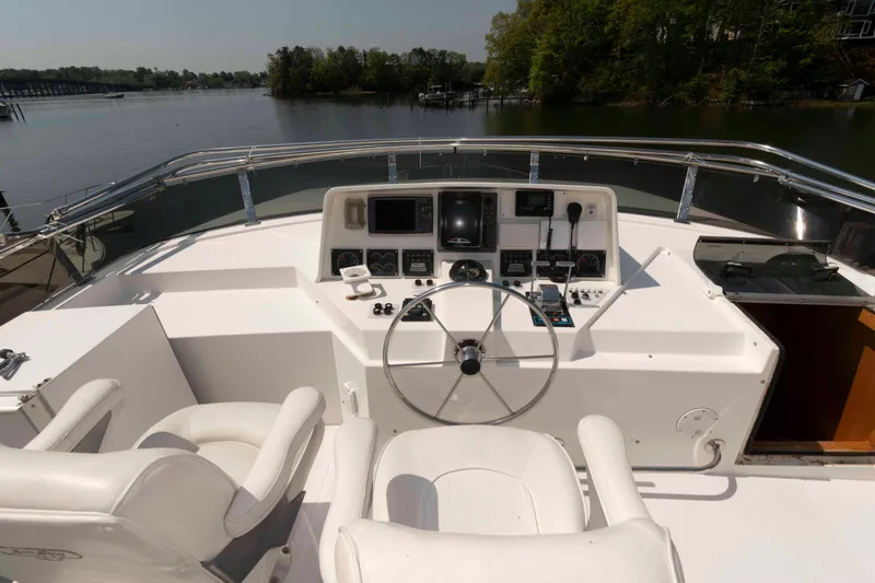 Slide: The Image of Cockpit of 1999 West Bay 58 Sonship Pilothouse MY with steering wheel and navigation controls. - 10