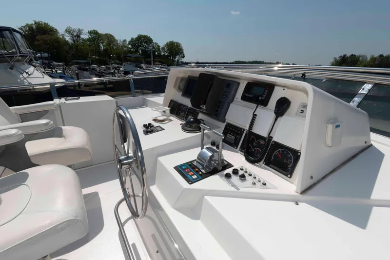 Slide: The Image of 1999 West Bay 58 Sonship Pilothouse MY helm with navigation instruments and steering wheel. - 11