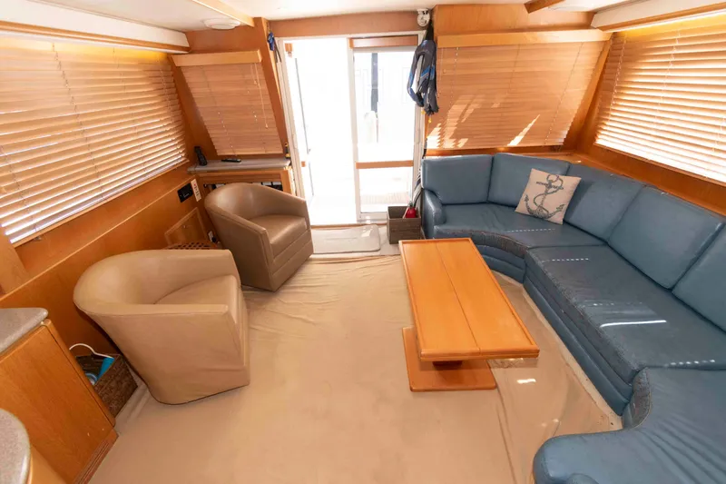 Slide: The Image of Luxurious 1999 West Bay 58 Sonship Pilothouse MY interior with kitchenette and wooden cabinetry. - 20