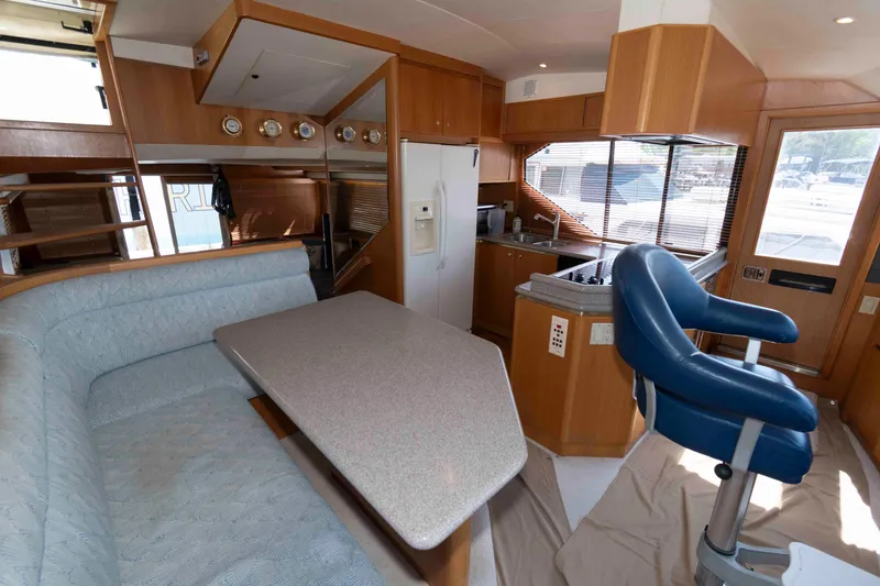 Slide: The Image of Luxurious bedroom in 1999 West Bay 58 Sonship Pilothouse yacht with wood furnishings. - 28