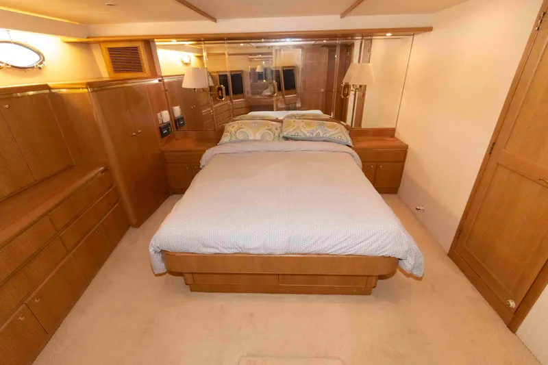 Slide: The Image of Luxurious bedroom interior of 1999 West Bay 58 Sonship Pilothouse yacht with wood cabinetry. - 29