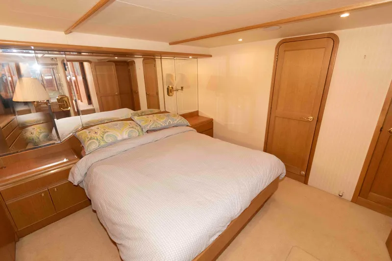 Slide: The Image of Luxurious 1999 West Bay 58 Sonship Pilothouse MY cabin with wood cabinetry and built-in TV. - 31
