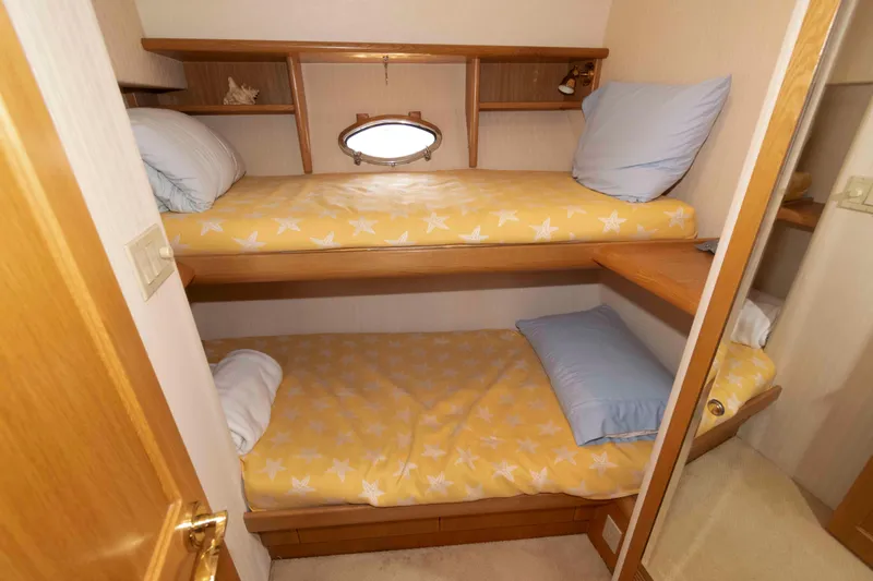 Slide: The Image of Interior of 1999 West Bay 58 Sonship Pilothouse MY with TV and wooden cabinetry. - 34