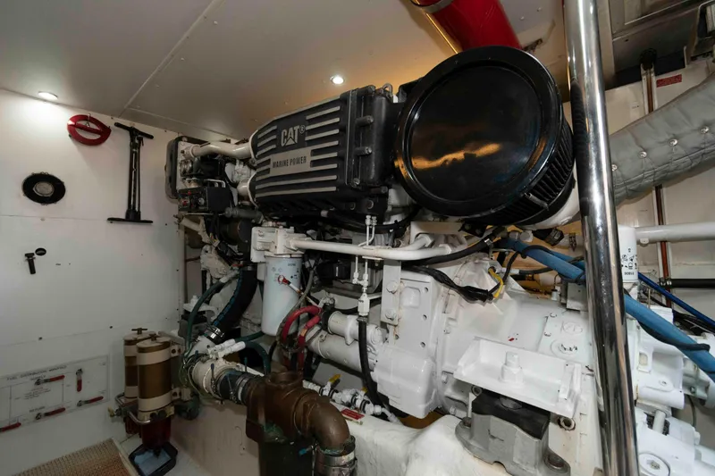Slide: The Image of Engine room of 1999 West Bay 58 Sonship Pilothouse MY yacht, featuring machinery and piping. - 43