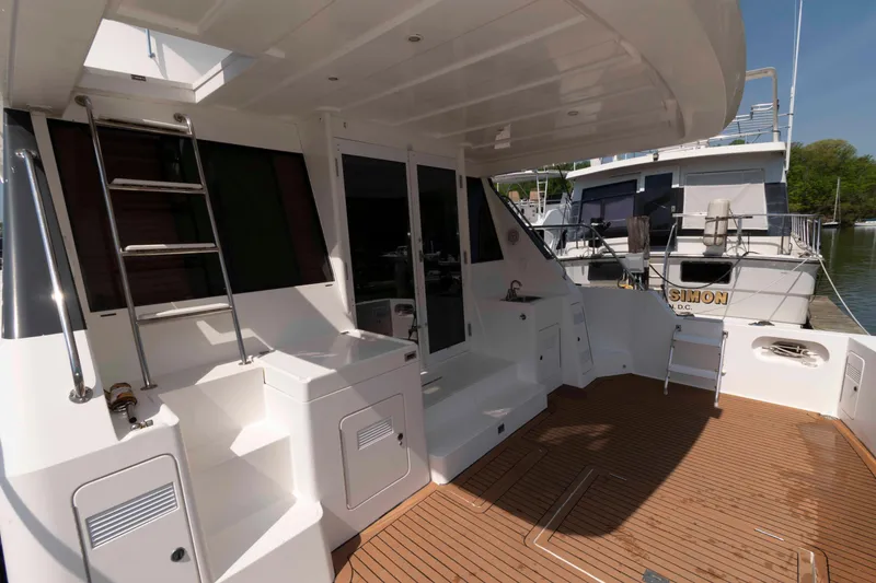Slide: The Image of Outdoor grill area on 1999 West Bay 58 Sonship Pilothouse MY yacht. - 5