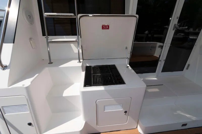 Slide: The Image of Luxurious 1999 West Bay 58 Sonship Pilothouse MY yacht with stylish striped seating. - 6