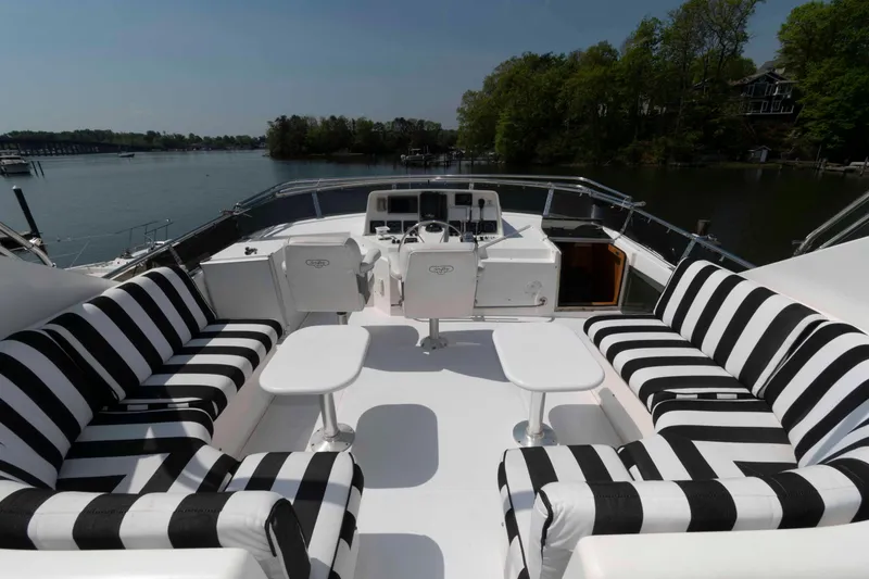 Slide: The Image of Striped seating on 1999 West Bay 58 Sonship Pilothouse MY yacht deck. - 7