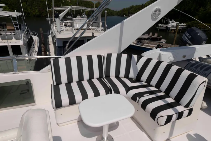 Slide: The Image of Cockpit view of 1999 West Bay 58 Sonship Pilothouse MY yacht on a serene lake. - 9