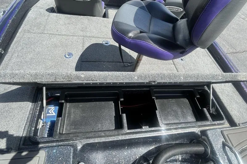 Slide: The Image of 2025 Phoenix 919 ZXL boat interior with storage compartments and seating. - 13