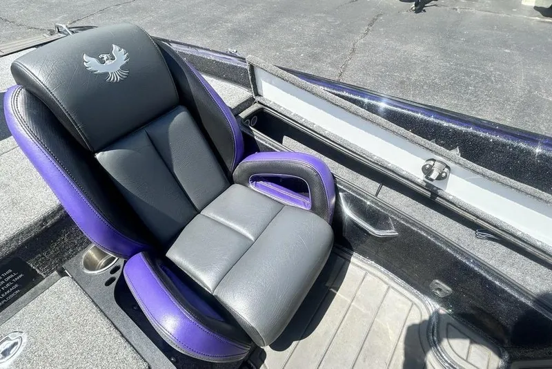 Slide: The Image of Luxurious black and purple seat in 2025 Phoenix 919 ZXL boat, featuring sleek design and comfort. - 17