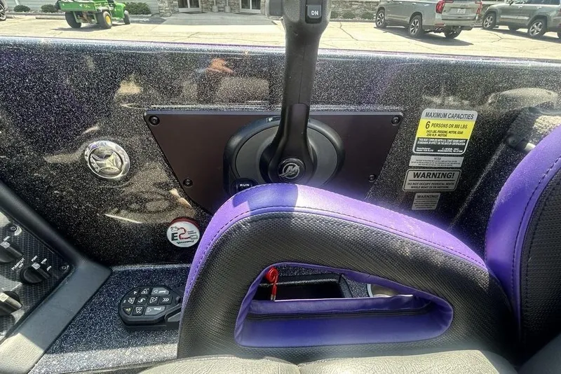 Slide: The Image of Interior of a 2025 Phoenix 919 ZXL boat with control panel and seating. - 21