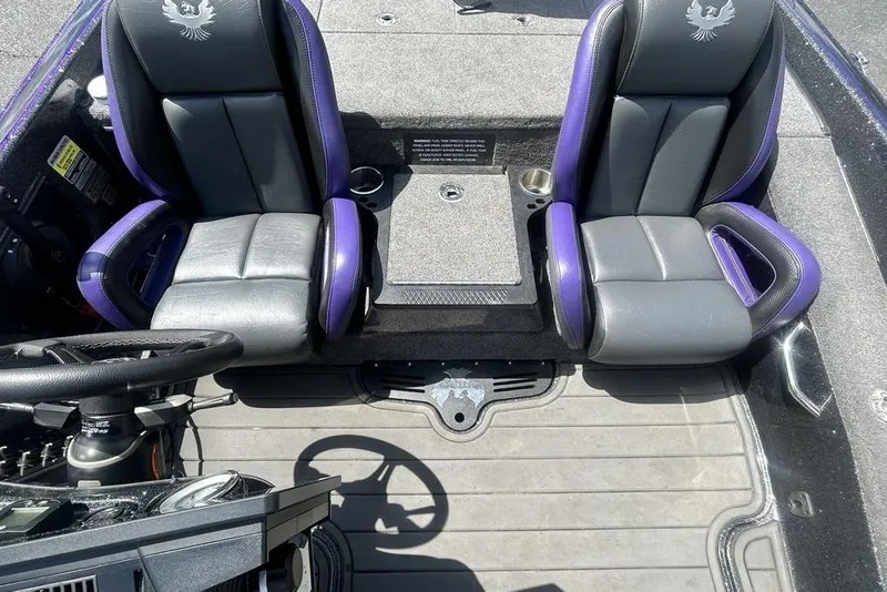 Slide: The Image of Interior of 2025 Phoenix 919 ZXL boat with dual black and purple seats. - 8