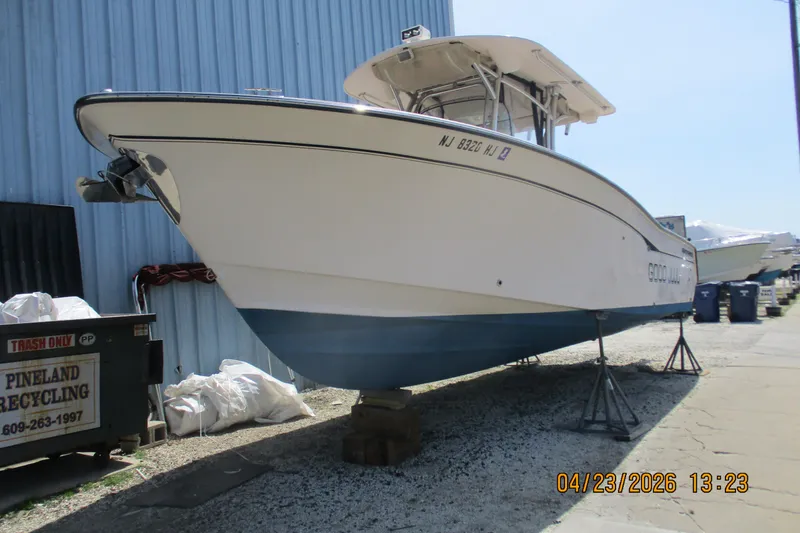 Slide: The Image of 2007 Grady-White Bimini 306 boat on stands, dockside, sunny day. - 11