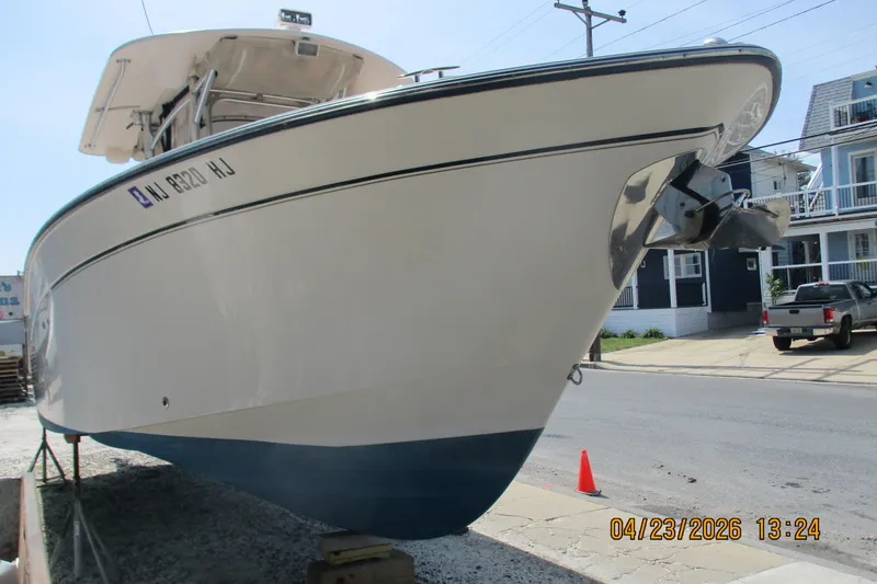 Slide: The Image of 2007 Grady-White Bimini 306 boat on trailer, street view. - 12