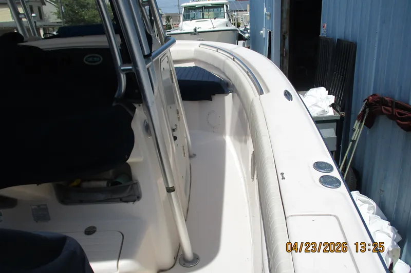 Slide: The Image of 2007 Grady-White Bimini 306 boat interior, docked near blue building. - 15