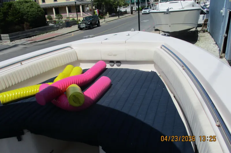 Slide: The Image of 2007 Grady-White Bimini 306 boat with colorful pool noodles on deck. - 17