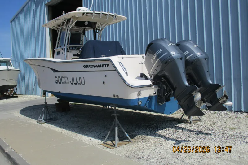 Slide: The Image of 2007 Grady-White Bimini 306 boat with twin Yamaha engines on stands. - 18