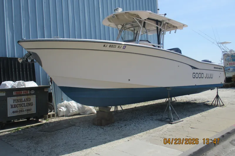 Slide: The Image of 2007 Grady-White Bimini 306 boat named "Good Juju" on stands, side view. - 20