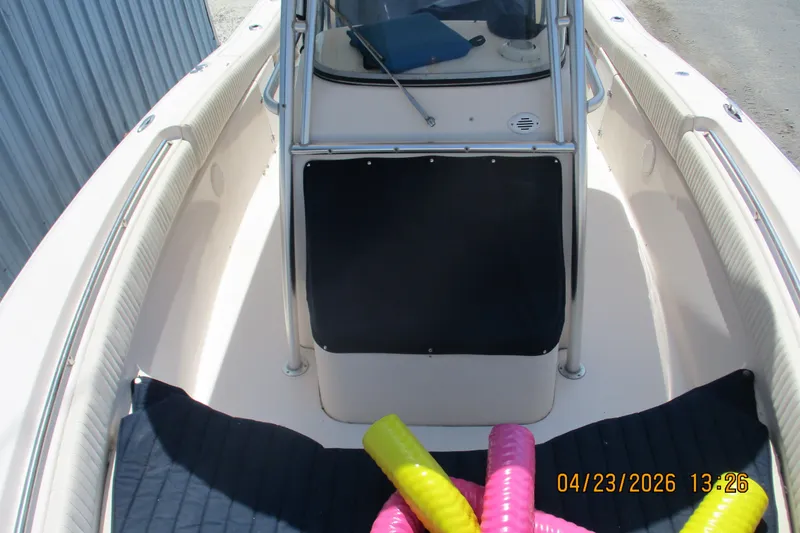Slide: The Image of 2007 Grady-White Bimini 306 boat interior with colorful pool noodles on deck. - 3
