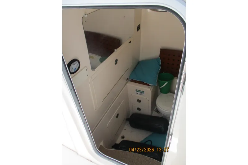Slide: The Image of Interior cabin of 2007 Grady-White Bimini 306 boat with seating and storage. - 5