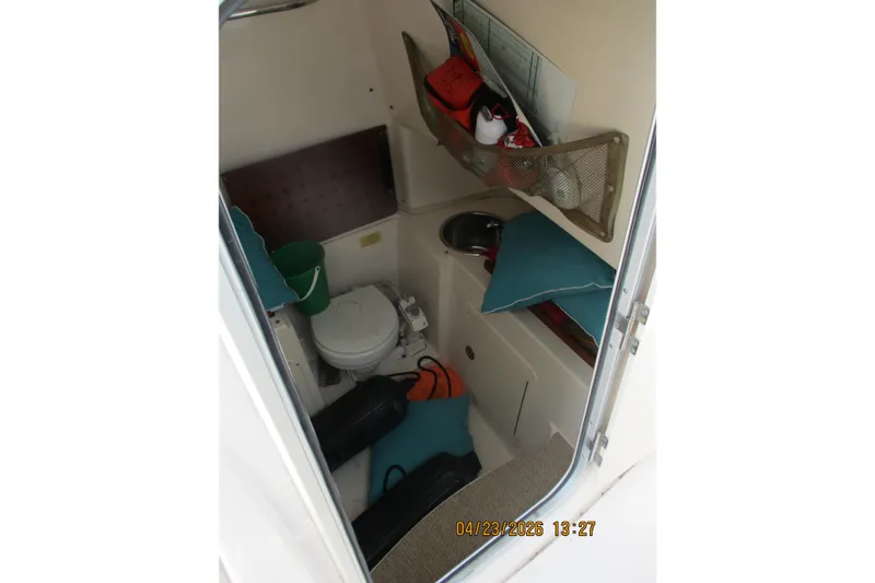 Slide: The Image of Interior of 2007 Grady-White Bimini 306 boat cabin with toilet and storage. - 6
