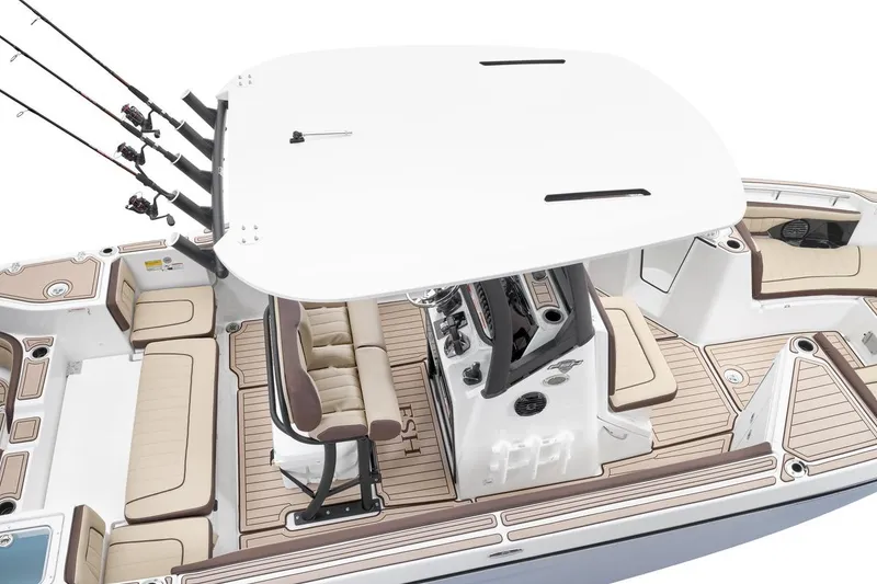 Slide: The Image of 2026 Yamaha Boats 255 FSH Sport E interior with seating and fishing rod holders. - 15