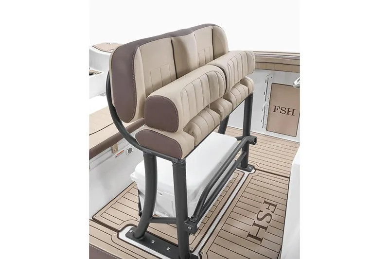 Slide: The Image of Manufacturer Provided Image: 2026 Yamaha Boats 255 FSH Sport E interior with cushioned seating and teak-style flooring. - 2