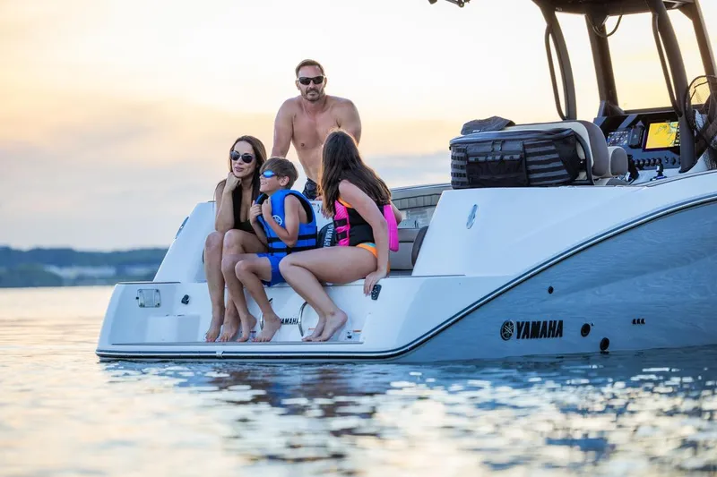Slide: The Image of Family enjoying a day on a 2026 Yamaha Boats 255 FSH Sport E. - 21