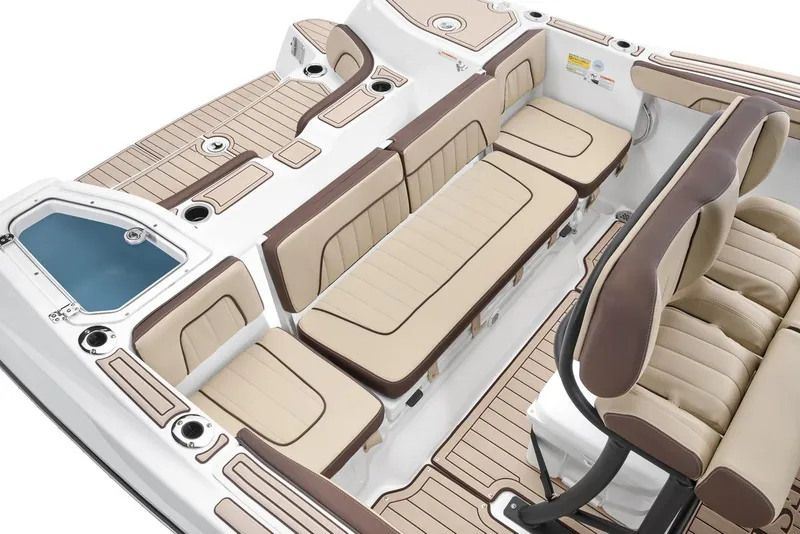 Slide: The Image of 2026 Yamaha Boats 255 FSH Sport E interior with beige seating and sleek design. - 7