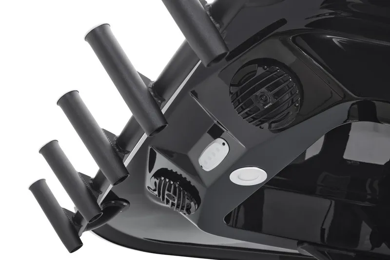 Slide: The Image of Close-up of 2026 Yamaha Boats 255 FSH Sport E, featuring rod holders and speaker system. - 9