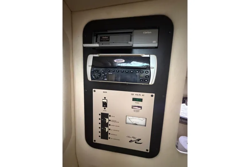 Slide: The Image of Control panel of a 2003 Sea Ray 290 Bow Rider boat with Clarion audio system. - 24