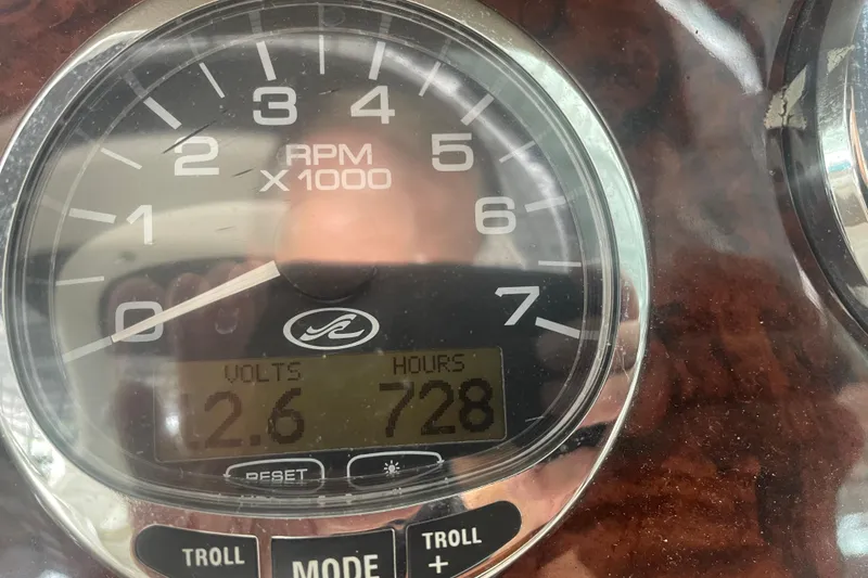 Slide: The Image of Close-up of 2003 Sea Ray 290 Bow Rider tachometer showing 728 hours and 12.6 volts. - 34