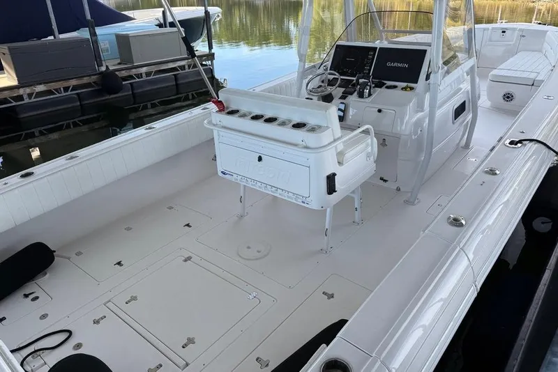 Slide: The Image of 2005 Intrepid 370 Center Console boat with spacious deck and modern controls. - 10