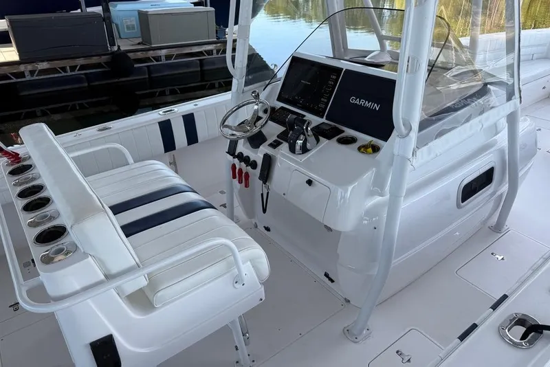 Slide: The Image of 2005 Intrepid 370 Center Console boat interior with Garmin navigation system and seating. - 11